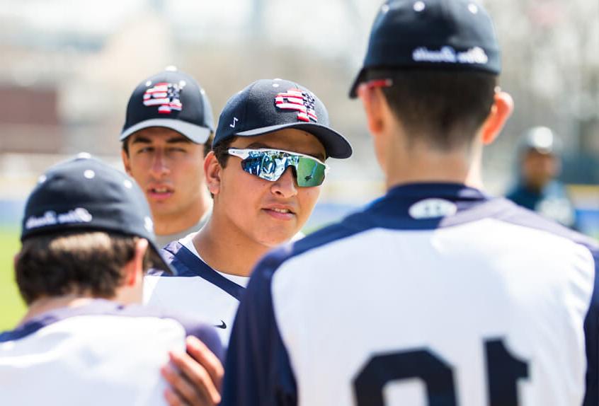 Poly Prep Baseball athletes in a team meeting